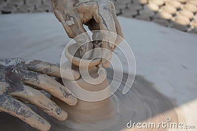 Potter makes earthen lamps or â€˜diyasâ€™ ahead of the forthcoming Diwali festival Stock Photo